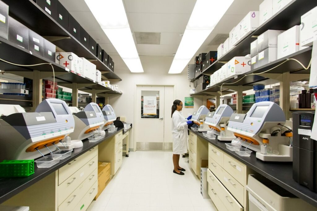 Technician working with laboratory sequencing equipment